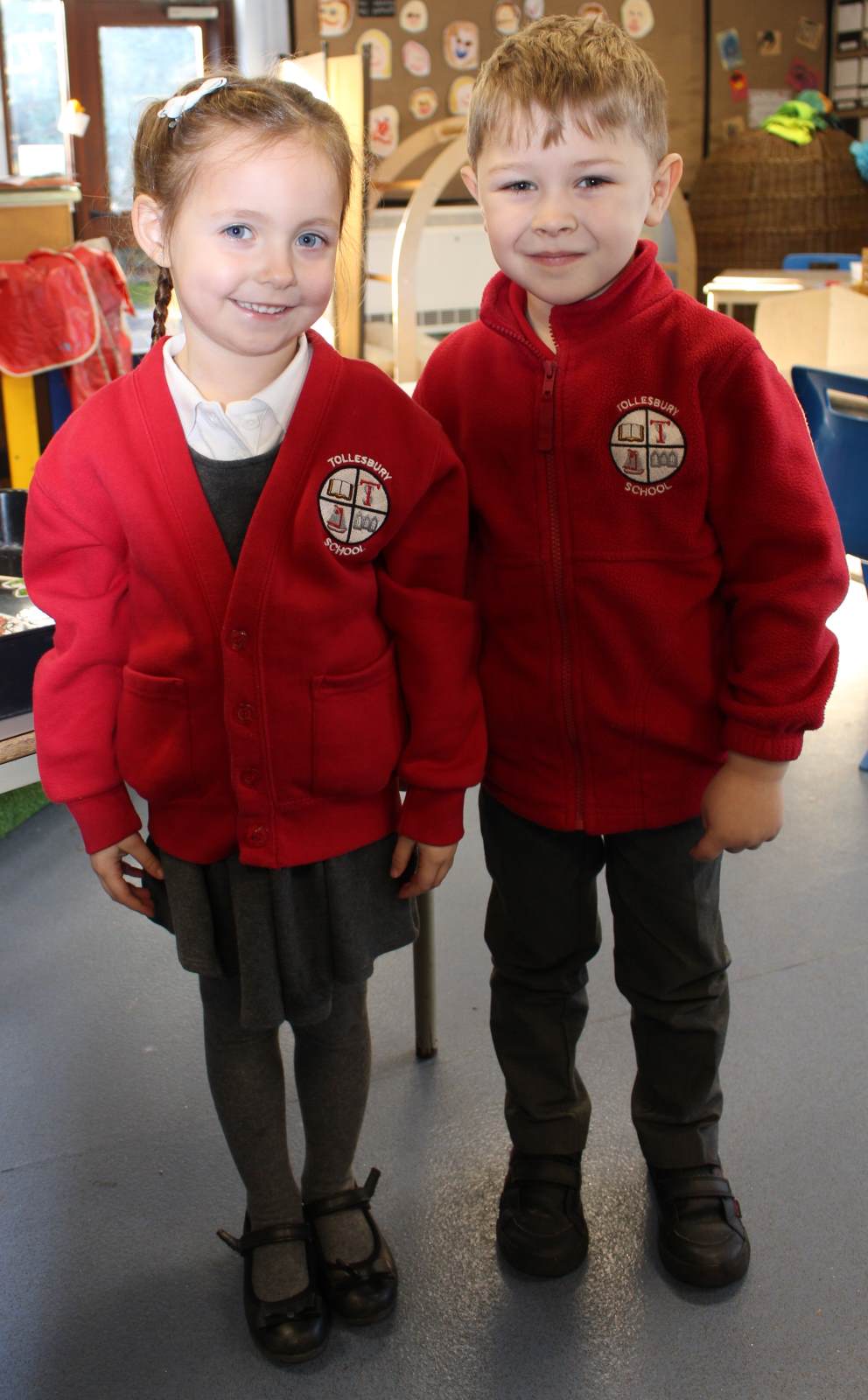 uniform A girl and by wearing Tollesbury School Uniform